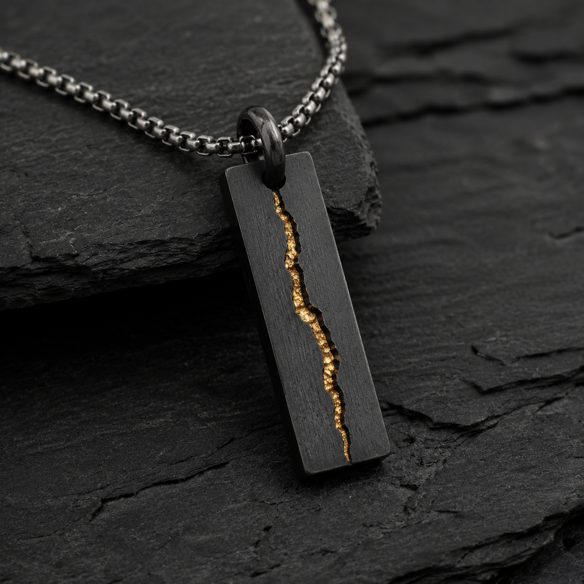 Rift Pendant
Handcrafted Oxidised Sterling Silver & 24K Gold Pendant